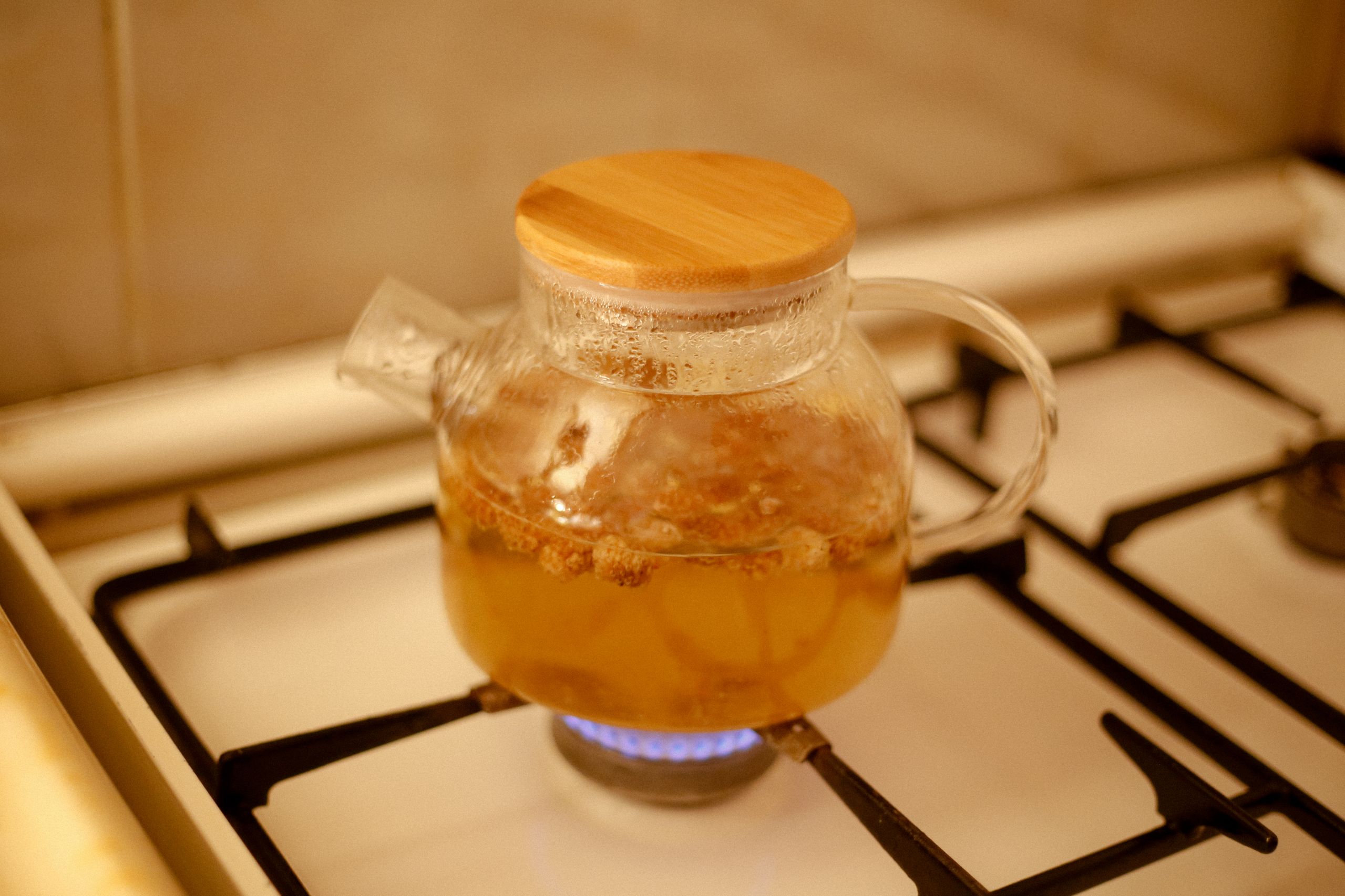 Copper kettle steaming on a gas stovetop